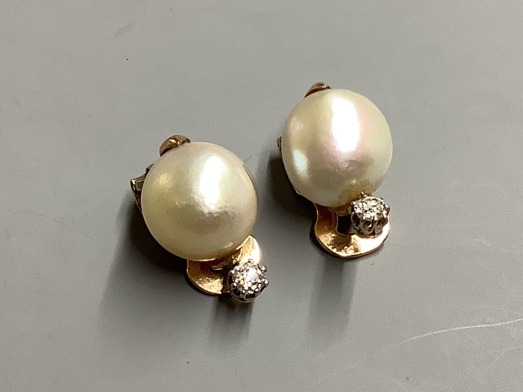 A pair of yellow metal, baroque pearl and diamond set ear clips